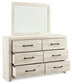 Cambeck King Upholstered Panel Bed with Mirrored Dresser and Chest